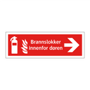 Brannslokker innenfor døren