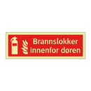 Brannslokker innenfor døren