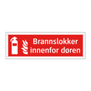Brannslokker innenfor døren