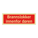Brannslokker innenfor døren