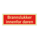 Brannslukker innenfor døren
