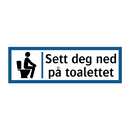 Sett deg ned på toalettet